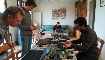 A photograph of Kdenlive developers at a spring