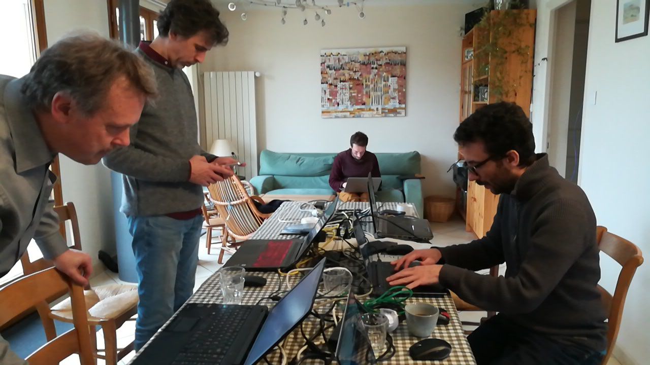 A photograph of Kdenlive developers at a spring