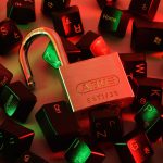 Padlock on computer keys.