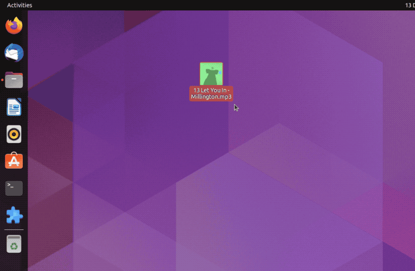 an animated gif showing an mp3 file being dropped on the Ubuntu Dock icon for rhythmbox, opening it and triggering playback