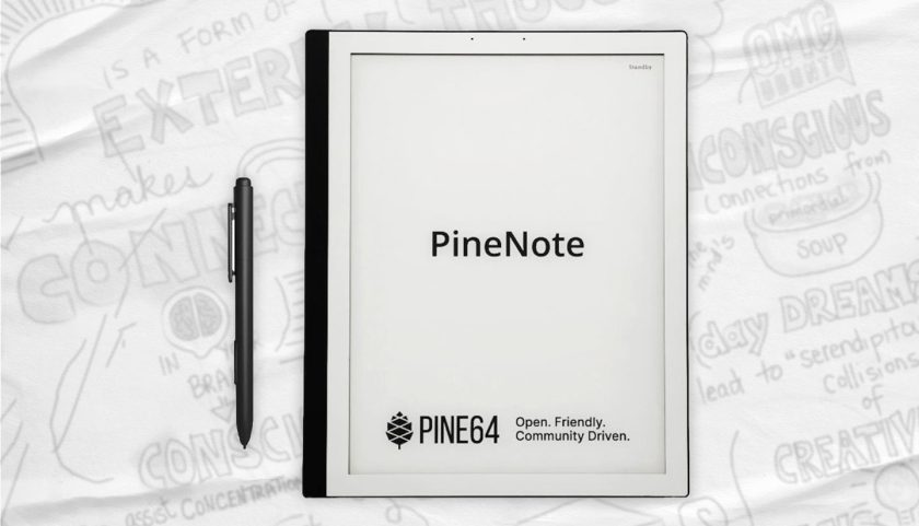 PineNote and EMR stylus on a background covered with doodles