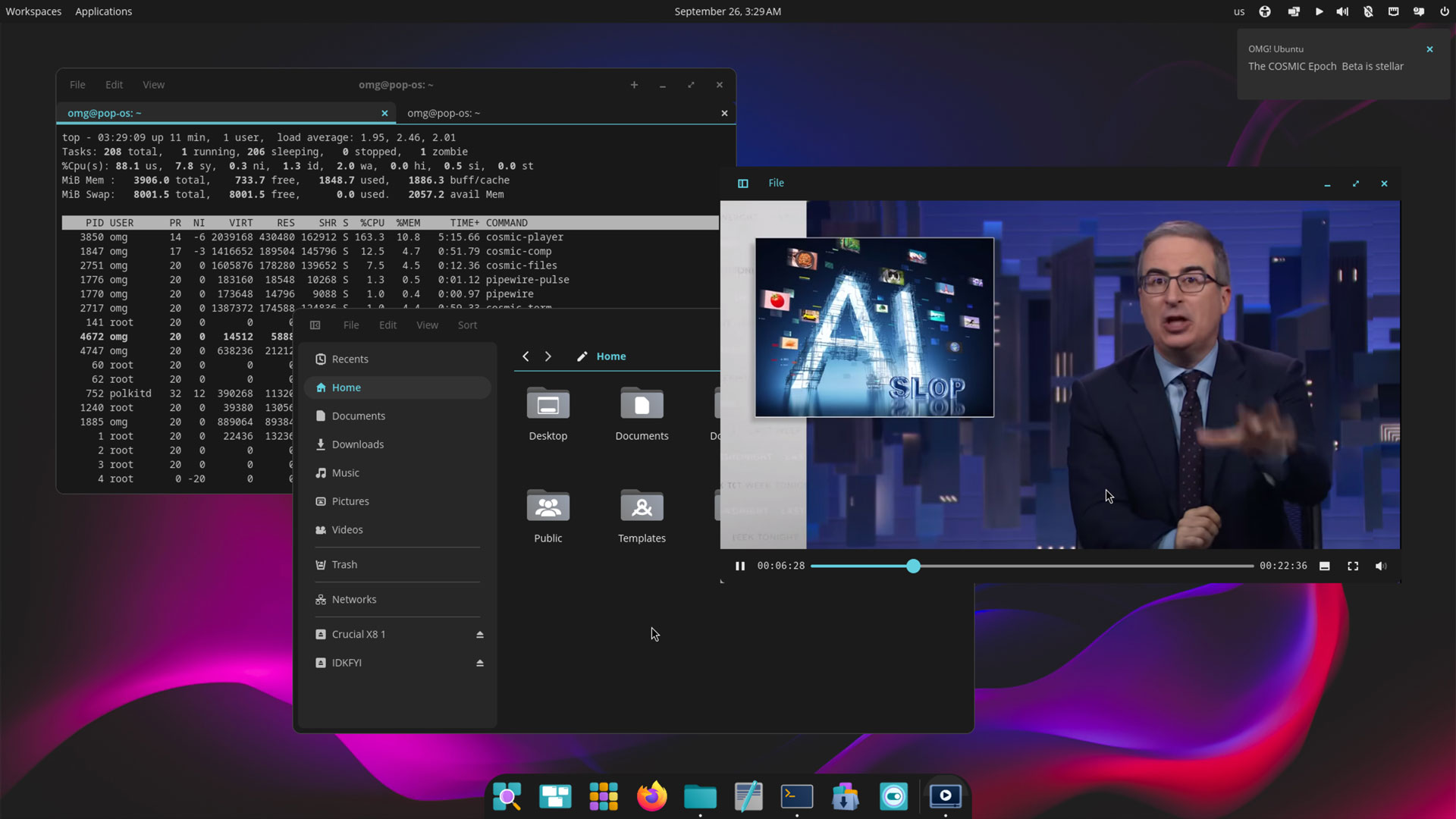 COSMIC desktop showing a video player with apps including a video player and terminal open.