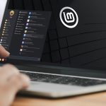 A laptop showing the Linux Mint desktop.