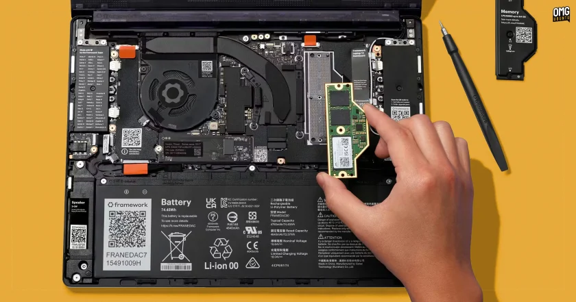 LPCAMM2 memory module being placed into a laptop.