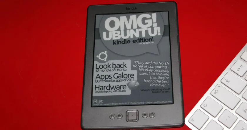 Kindle 4th Gen on a red desk showing the front cover of an ebook.
