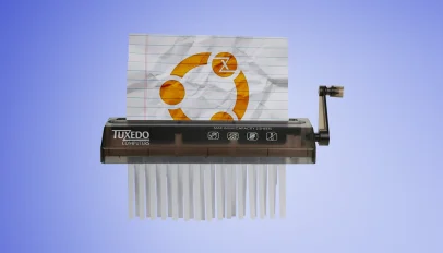 Paper with Ubuntu logo being fed into a paper shredder.