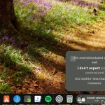 Dynamic Music Pill extension showing track lyrics in pop over on Ubuntu Dock