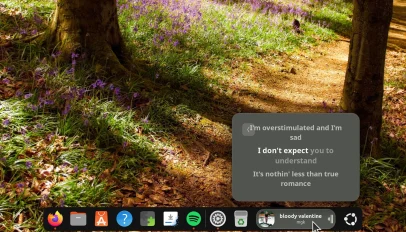Dynamic Music Pill extension showing track lyrics in pop over on Ubuntu Dock