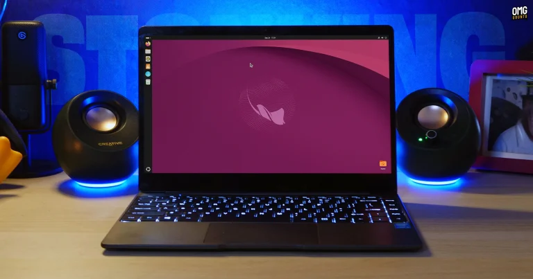 A laptop on a desk shows Ubuntu 26.10 Stonking Stingray desktop